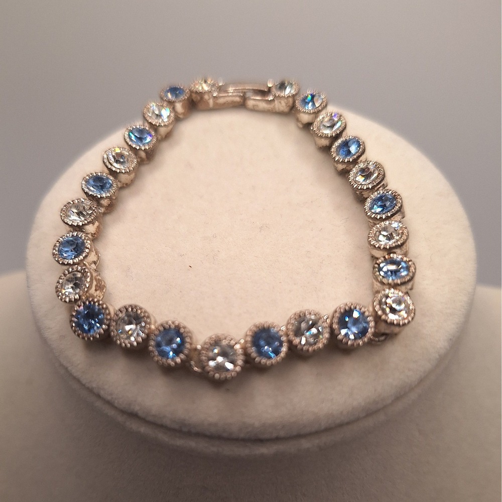 Vintage 1928 Jewelry Company blue tennis bracelet clear rhinestones milgrain